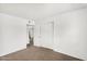 Bedroom with neutral carpet and white walls at 6313 W Carol Ave, Glendale, AZ 85302