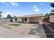 Well-maintained single-story home featuring a covered carport and low maintenance landscaping at 6313 W Carol Ave, Glendale, AZ 85302