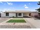 Charming single-story home with a well-maintained front yard and a convenient covered carport at 6313 W Carol Ave, Glendale, AZ 85302