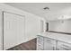 Bright kitchen with white cabinets and granite countertop offers great storage and workspace at 6313 W Carol Ave, Glendale, AZ 85302