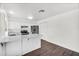 Efficient kitchen featuring white cabinets, stainless steel appliances, and breakfast bar at 6313 W Carol Ave, Glendale, AZ 85302