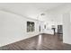 Open concept living area with wood-look floors and abundant natural light at 6313 W Carol Ave, Glendale, AZ 85302