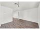 Large living area features wood-look floors and neutral paint at 6313 W Carol Ave, Glendale, AZ 85302
