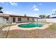 Backyard view of pool with white fence, landscaping and house at 6313 W Carol Ave, Glendale, AZ 85302