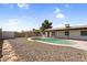Backyard view of pool with white fence and landscaping at 6313 W Carol Ave, Glendale, AZ 85302
