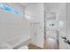 Well-lit bathroom showcases a combined tub and shower with white subway tile and modern fixtures at 8426 W Solano Dr, Glendale, AZ 85305