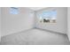 Cozy bedroom with soft carpet flooring, natural light and bright neutral paint at 8426 W Solano Dr, Glendale, AZ 85305