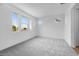 Well-lit bedroom with soft carpet, ample windows, and neutral color scheme at 8426 W Solano Dr, Glendale, AZ 85305