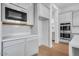 Modern kitchen boasts stainless steel appliances, gray cabinets, and a built-in microwave at 8426 W Solano Dr, Glendale, AZ 85305