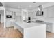 Spacious kitchen features a large center island, stainless steel appliances, and modern finishes at 8426 W Solano Dr, Glendale, AZ 85305
