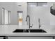 Stylish kitchen sink with modern faucets, complemented by bright interiors at 8426 W Solano Dr, Glendale, AZ 85305