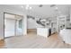 Open-concept living space with sleek floors, modern staircase, and ample natural light at 8426 W Solano Dr, Glendale, AZ 85305