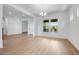 Bright living space with wood floors, large windows, and smooth transitions to other rooms at 8426 W Solano Dr, Glendale, AZ 85305