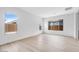 Bright living room with natural light showcases beautiful hardwood floors and neutral paint at 8426 W Solano Dr, Glendale, AZ 85305
