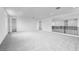 Expansive loft area featuring neutral carpet, recessed lighting, and a versatile open space at 8426 W Solano Dr, Glendale, AZ 85305