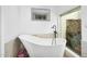 Serene bathroom featuring a modern soaking tub and a view of the outdoors at 8935 N 82Nd St, Scottsdale, AZ 85258