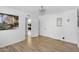 Bright bedroom featuring hardwood floors, white walls, and a decorative chandelier at 8935 N 82Nd St, Scottsdale, AZ 85258