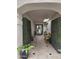 Charming entryway features tile flooring, bench, and greenery for a welcoming touch at 8935 N 82Nd St, Scottsdale, AZ 85258