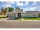 Elegant home with a two-car garage, gated courtyard, manicured lawn, and stucco exterior at 8935 N 82Nd St, Scottsdale, AZ 85258