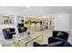 Spacious living area with tile floors, modern lighting, and a gourmet kitchen in the background at 8935 N 82Nd St, Scottsdale, AZ 85258