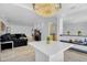 Open-concept living room with chandelier and view of the kitchen and patio at 8935 N 82Nd St, Scottsdale, AZ 85258