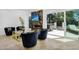 Stylish living room with fireplace, large windows, and backyard access at 8935 N 82Nd St, Scottsdale, AZ 85258