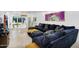 Open-concept living room with a large sectional couch and access to the backyard at 8935 N 82Nd St, Scottsdale, AZ 85258
