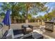 Inviting patio with outdoor furniture, built in BBQ, manicured trees and wrought iron fence at 8935 N 82Nd St, Scottsdale, AZ 85258