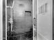 Contemporary shower featuring black marble tiles and a rainfall shower head at 8935 N 82Nd St, Scottsdale, AZ 85258