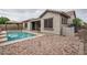 A well-maintained backyard featuring a sparkling pool, and an inviting gazebo at 9041 W Redbird Rd, Peoria, AZ 85383