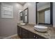 Bathroom featuring dual sinks with granite countertops at 9041 W Redbird Rd, Peoria, AZ 85383