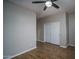 Bright bedroom featuring ceiling fan and hardwood floors at 9041 W Redbird Rd, Peoria, AZ 85383