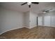 Bedroom with wood laminate flooring and a ceiling fan at 9041 W Redbird Rd, Peoria, AZ 85383