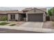 Charming single-story home with a well-maintained front yard and attached two-car garage in a desirable community at 9041 W Redbird Rd, Peoria, AZ 85383