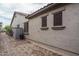Side view of the home showcasing the neutral color palette and brick pathway at 9041 W Redbird Rd, Peoria, AZ 85383