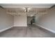 Spacious garage featuring high ceilings and storage racks at 9041 W Redbird Rd, Peoria, AZ 85383