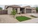 Charming home featuring well-maintained landscaping and curb appeal at 9041 W Redbird Rd, Peoria, AZ 85383