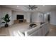 Inviting living room features tile floors, a modern ceiling fan, recessed lights and adjacent dining area at 9041 W Redbird Rd, Peoria, AZ 85383