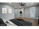 The main bedroom offers wood-style floors, recessed lighting, wall art, and an exterior door at 9041 W Redbird Rd, Peoria, AZ 85383