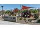 Community playground featuring shade structures, slides, and climbing equipment, perfect for Gathering fun and outdoor activities at 9041 W Redbird Rd, Peoria, AZ 85383