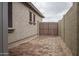 Side yard with brick pavers and gate leading to the backyard at 9041 W Redbird Rd, Peoria, AZ 85383