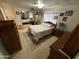 Bright bedroom with mirrored closet doors, ceiling fan, and floral bedding at 9501 E Broadway Rd # 21, Mesa, AZ 85208