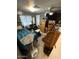 Bedroom with a ceiling fan, full sized bed, window and an office area at 9501 E Broadway Rd # 21, Mesa, AZ 85208