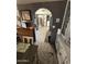 Open-concept dining area with a view into the kitchen and laundry room at 9501 E Broadway Rd # 21, Mesa, AZ 85208