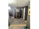 Cozy living room area with a decorative rug and display cabinet at 9501 E Broadway Rd # 21, Mesa, AZ 85208
