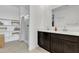 Bright bathroom with dual vanities, a walk-in shower, and storage shelves at 10004 S Smythe Dr, Apache Junction, AZ 85120