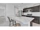 Modern kitchen featuring granite countertops, stainless steel appliances, and a breakfast bar at 10004 S Smythe Dr, Apache Junction, AZ 85120