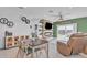 Living and dining area featuring modern fireplace, shelving, and open to backyard at 10004 S Smythe Dr, Apache Junction, AZ 85120