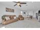 Bright and airy living room with an open floor plan and neutral color palette at 10004 S Smythe Dr, Apache Junction, AZ 85120