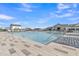 Sparkling pool surrounded by modern architecture, lounge chairs and manicured landscaping at 10004 S Smythe Dr, Apache Junction, AZ 85120